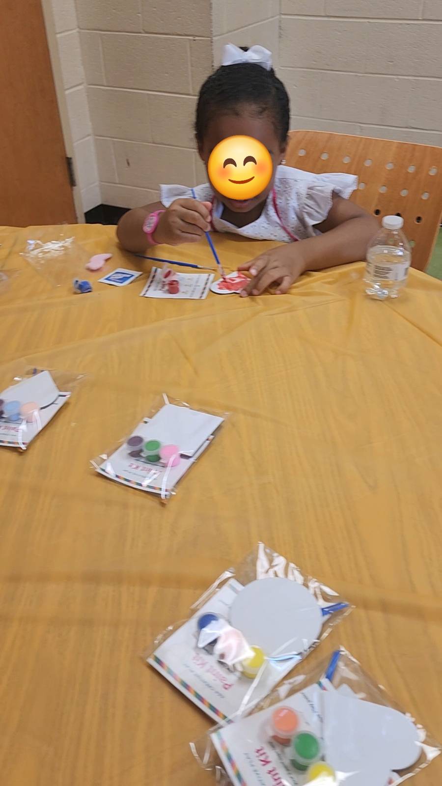 Birthday party guest painting their own magnet