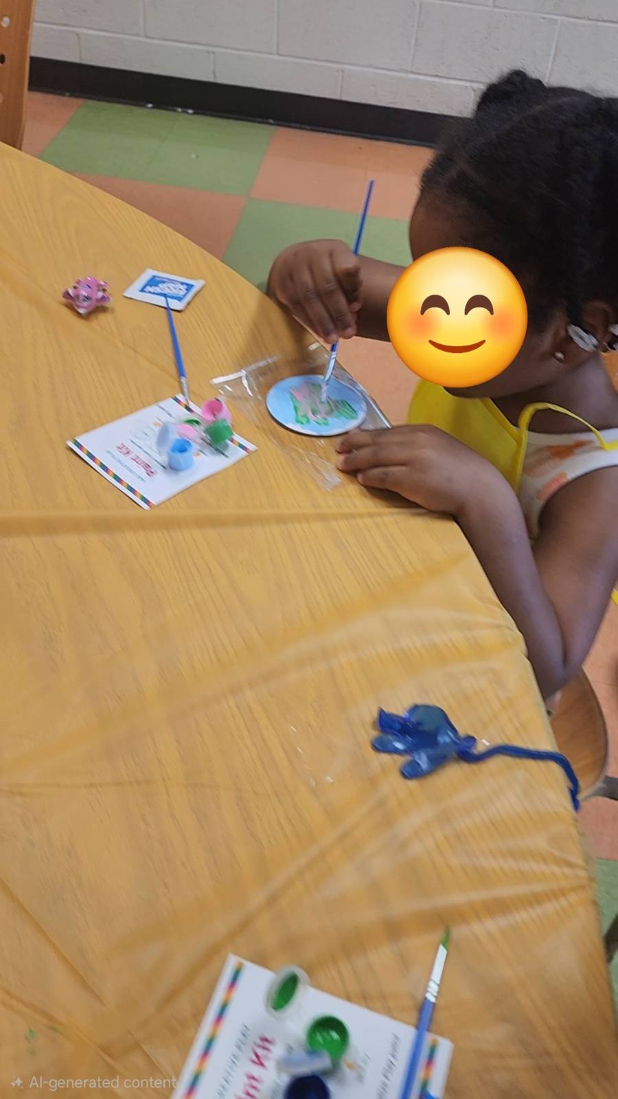 Birthday party guest painting their own magnet