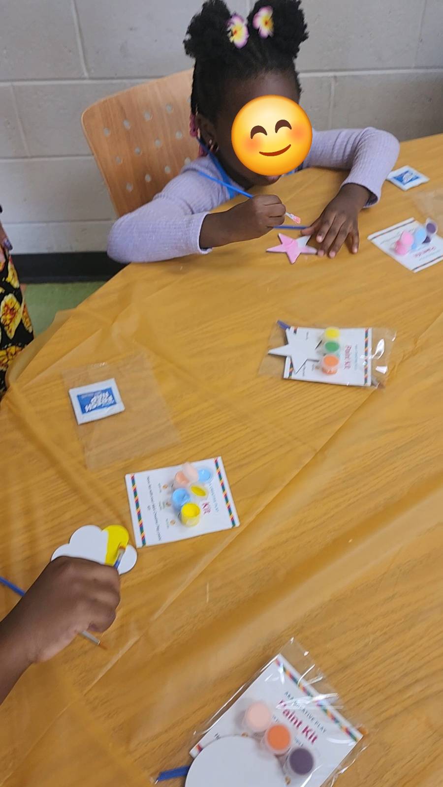 Birthday party guest painting their own magnet